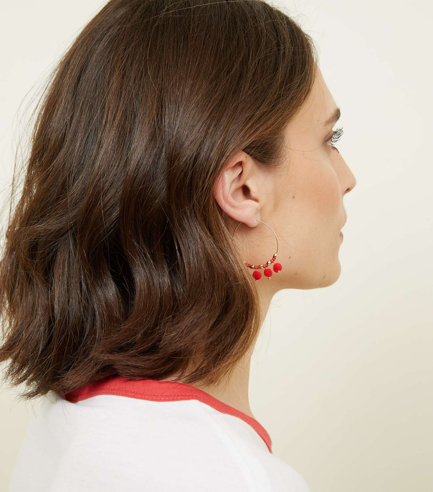 Red Pom Pom Hoop Earrings Image 2
