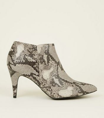 white booties snakeskin heel