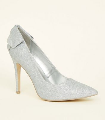 silver heels with bow on back