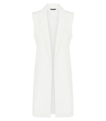 sleeveless white coat