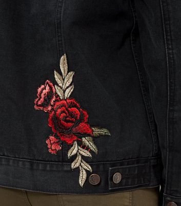 black jacket with red roses