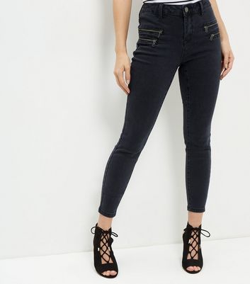 black jeans with zipper pockets