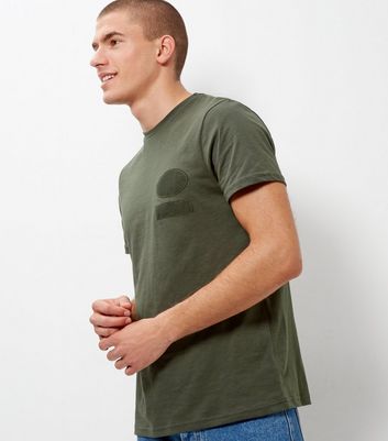 khaki shirt with blue jeans