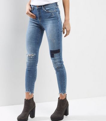 ripped patched skinny jeans