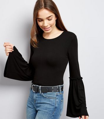black top with flared sleeves
