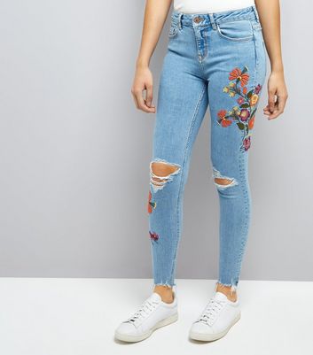 ripped floral jeans
