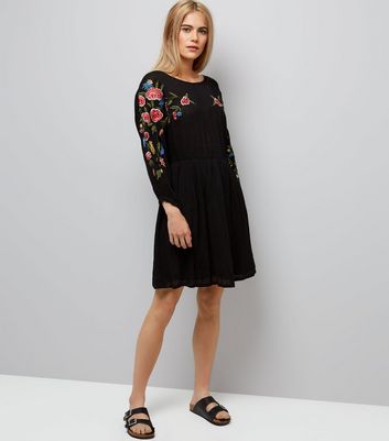 black dress with embroidered sleeves