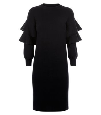 black jumper dress with white frill