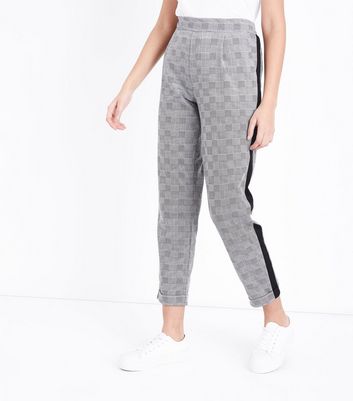 grey trousers with black stripe
