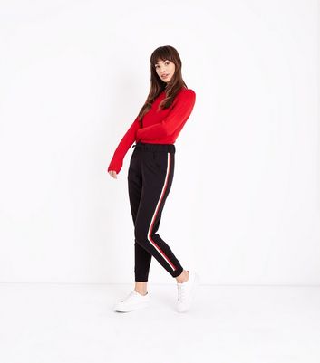 black trousers with red side stripe