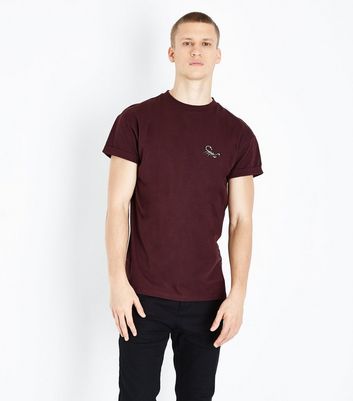 burgundy shirt black jeans