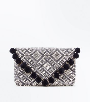 pom pom clutch bag