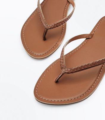 tan leather flip flops