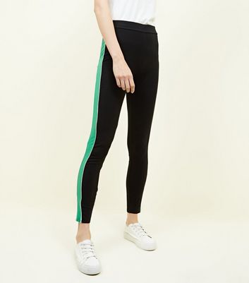 black pants with green side stripe