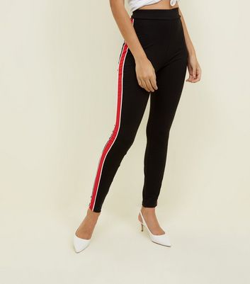 black pants with red side stripe