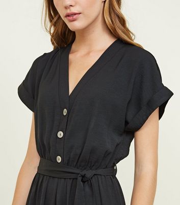 black buttoned jumpsuit