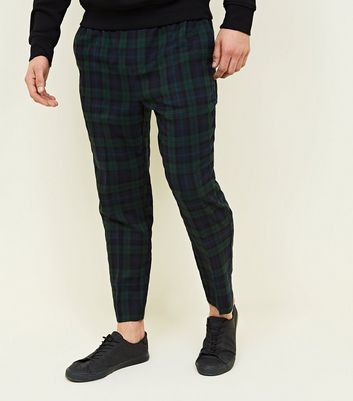 green and black check trousers