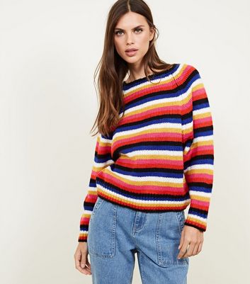 blue jumper with rainbow stripes