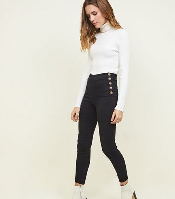 black jeans with buttons