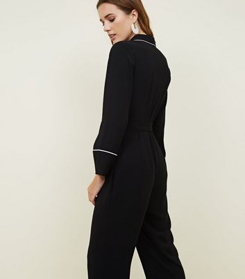 black jumpsuit with white piping