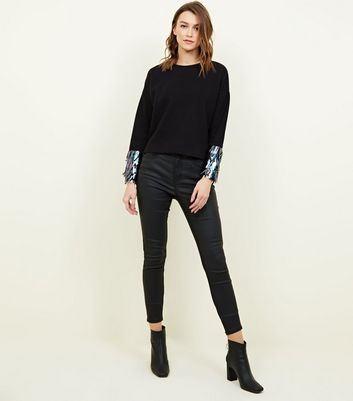black jumper with sequin sleeves