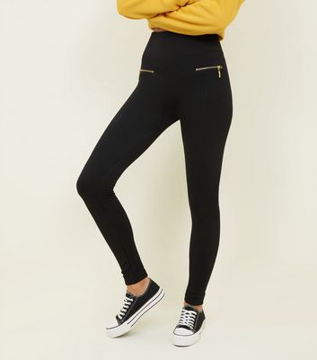 black leggings with gold zipper