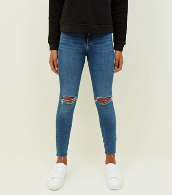 blue ripped knee skinny jeans