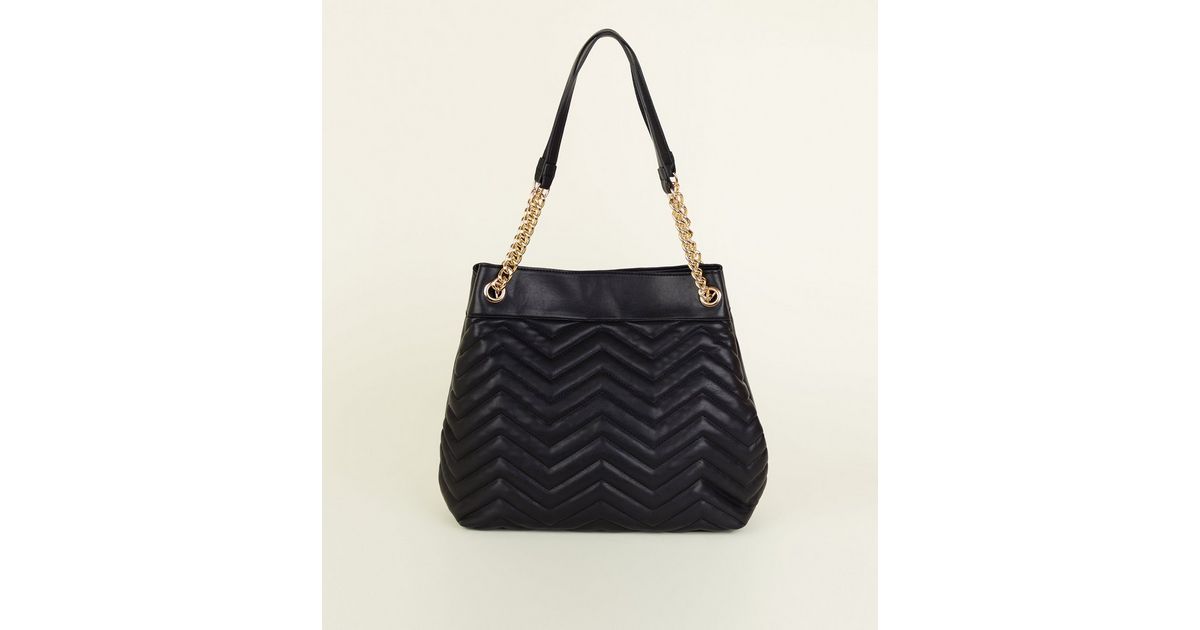 black quilted bag with chain strap