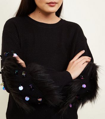 black jumper with fur sleeves