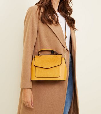new look mustard clutch bag