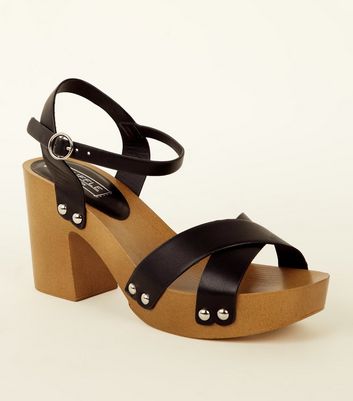 Black wooden platform store sandals