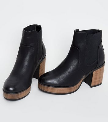 black leather booties with wooden heel