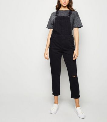 black ripped dungarees