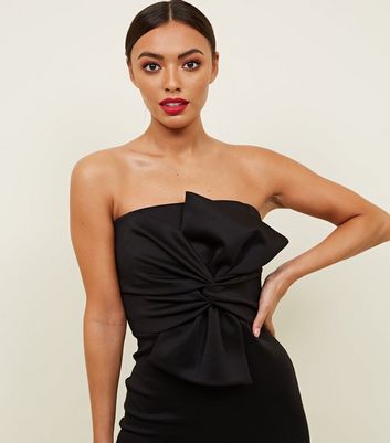 black dress with bow on front