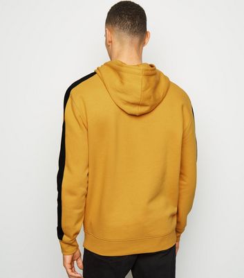 yellow hoodie black jeans