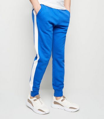 blue joggers with white stripe