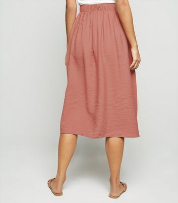 Pink button midi skirt best sale