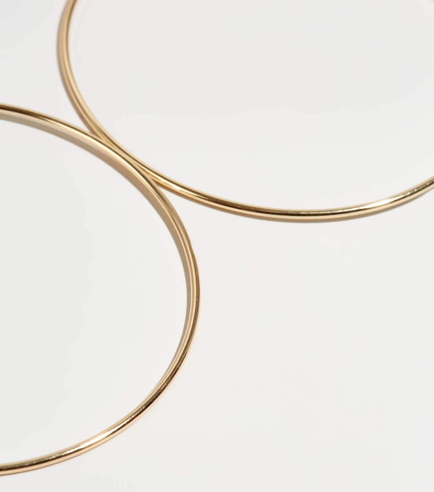 Gold Skinny Oversized Hoop Earrings Image 3
