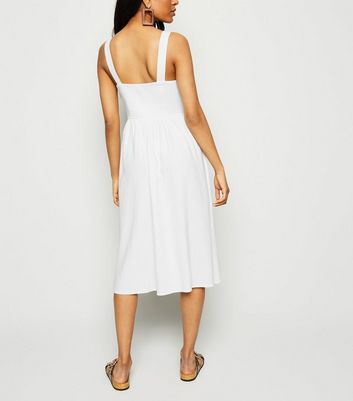 white linen dress with buttons