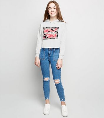 white hoodie blue jeans