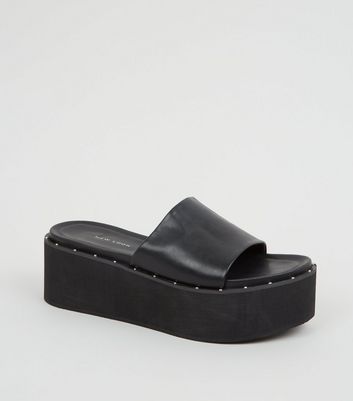 black leather flatforms