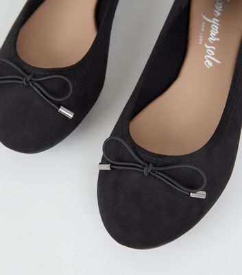 black shoes with bow on front