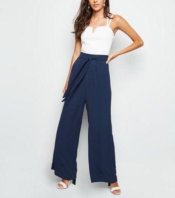 navy flared trousers