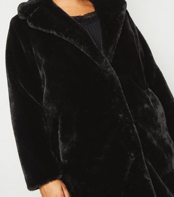 manteau noir fourrure