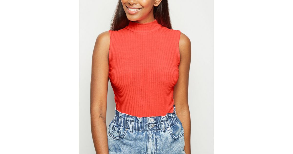bright orange turtleneck