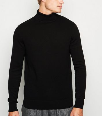grey trousers black jumper