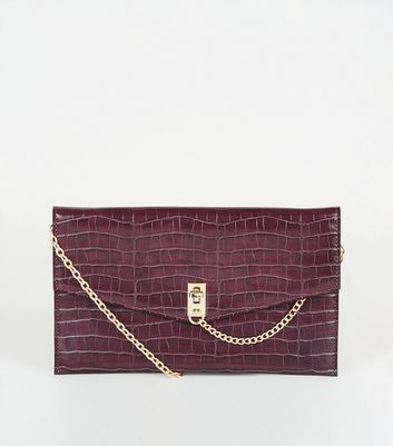 purple clutch bag new look