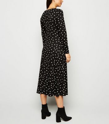 black spotted midi dress