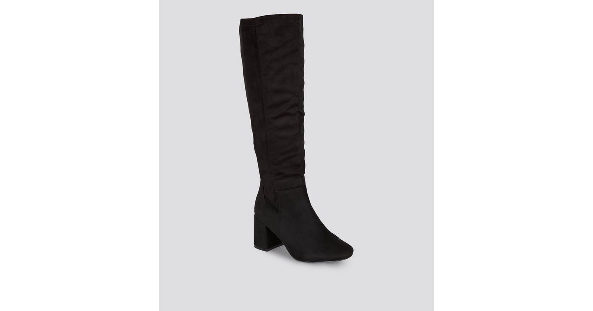flared heel knee high boots