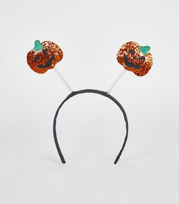 orange headband with pumpkins on